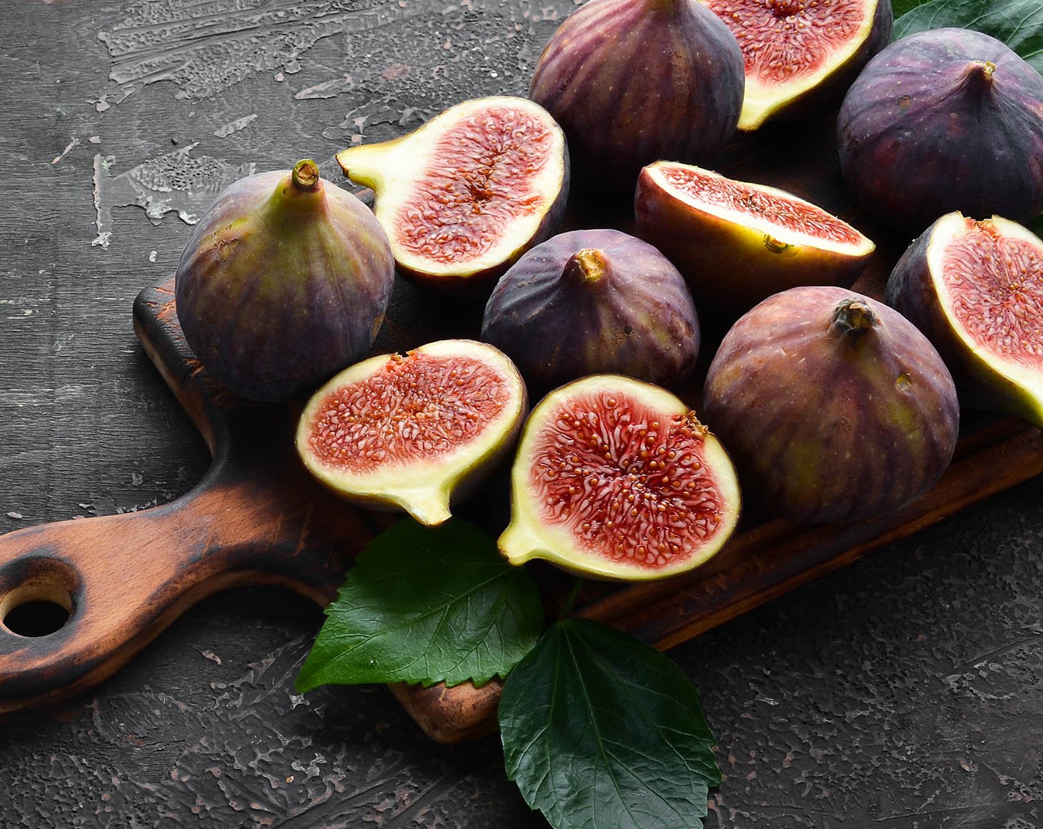 fresh-figs-black-stone-background-tropical-fruits-top-view-free-copy-space