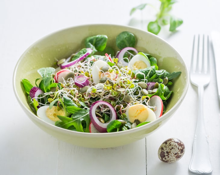 healthy-salad-made-of-quail-egg-and-sprouts-min