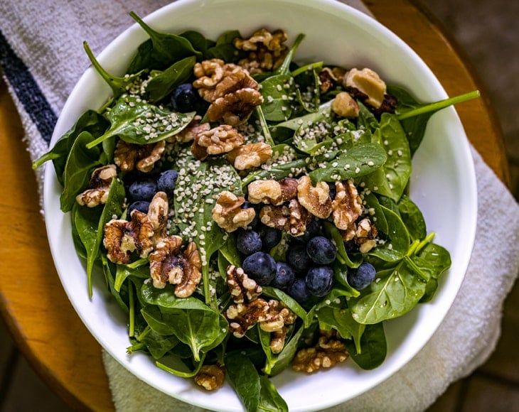 fresh-healthy-spinach-salad-with-dry-roasted-walnut-pieces-min