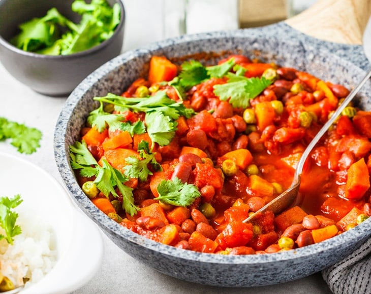 vegan-bean-stew-with-tomatoes-and-organic-ground-cayenne-pepper-min